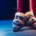 theater,masks,,drama,and,comedy,with,a,red,curtain,as