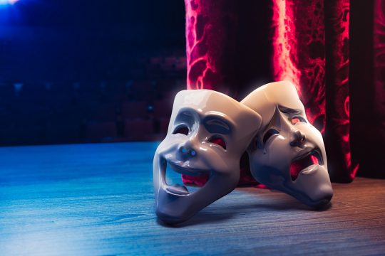 theater,masks,,drama,and,comedy,with,a,red,curtain,as