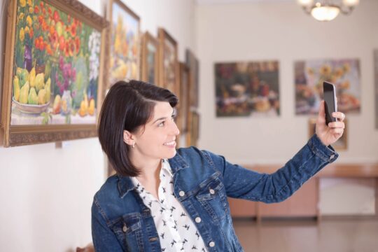 portrait,of,a,young,woman,taking,a,selfie,in,an