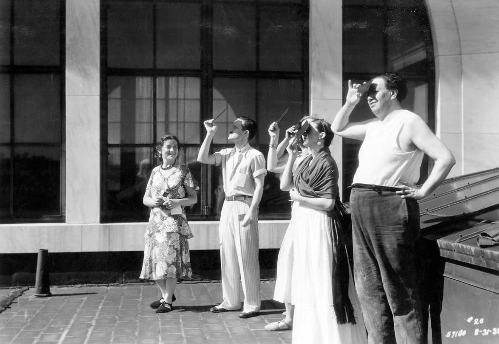 lucienne bloch, frida, and diego, with colleagues, viewing a solar eclipse on the dia roof (1932). courtesy of throckmorton fine art