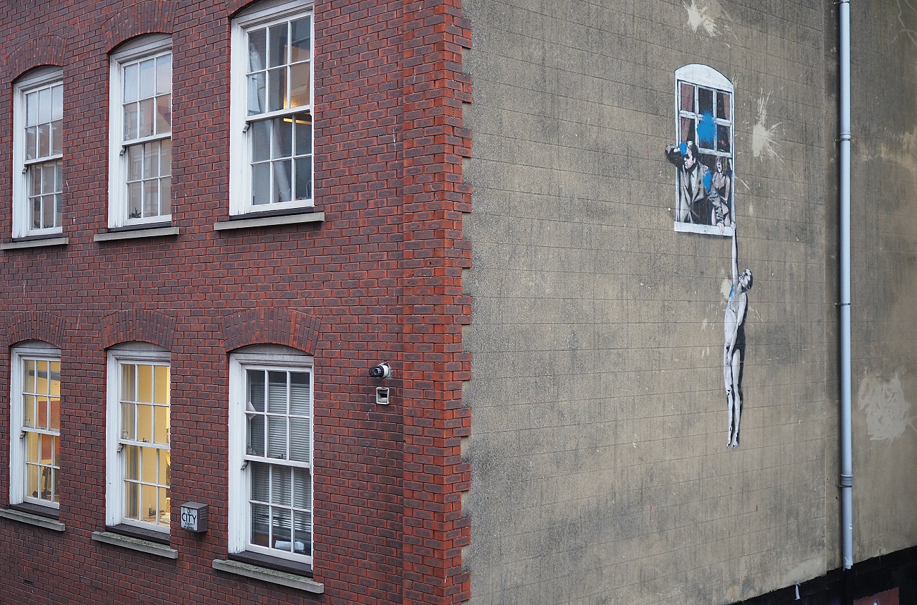 bristol,uk february,25,2016:,graffiti,of,the,street,artist,banksy,called,'naked