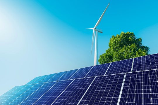 solar,panels,with,wind,turbines,in,blue,sky.,concept,of