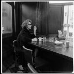 diane arbus, woman at a counter smoking, nyc, 1962