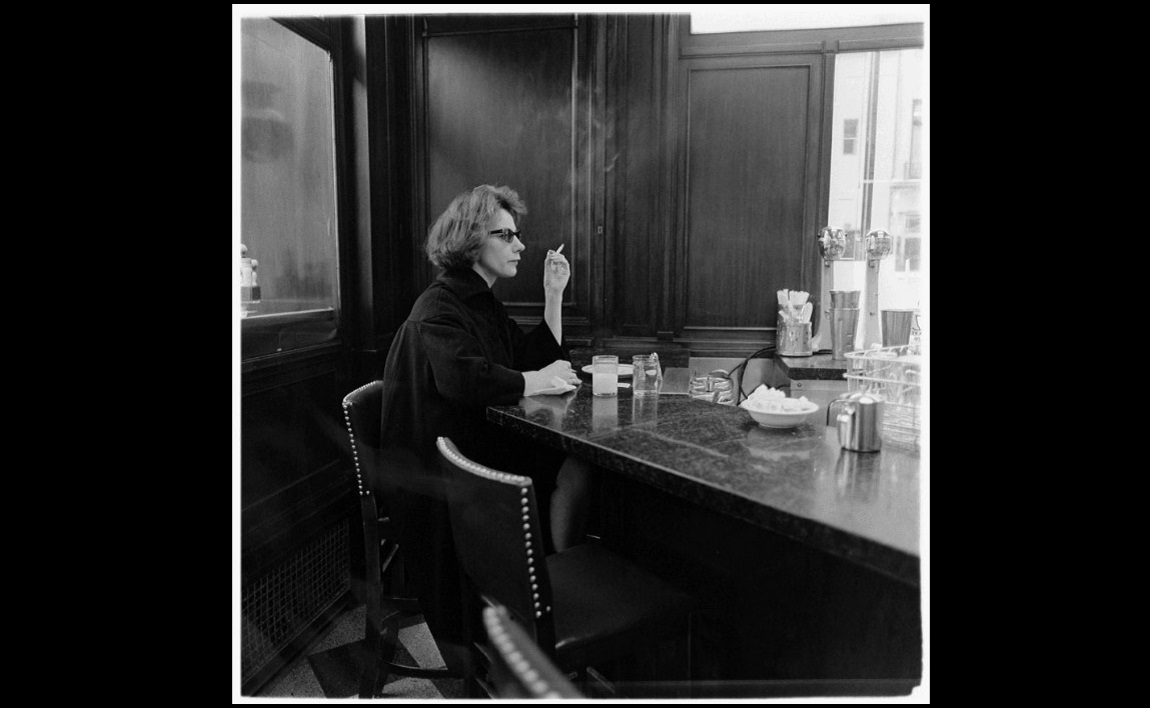 diane arbus, woman at a counter smoking, nyc, 1962