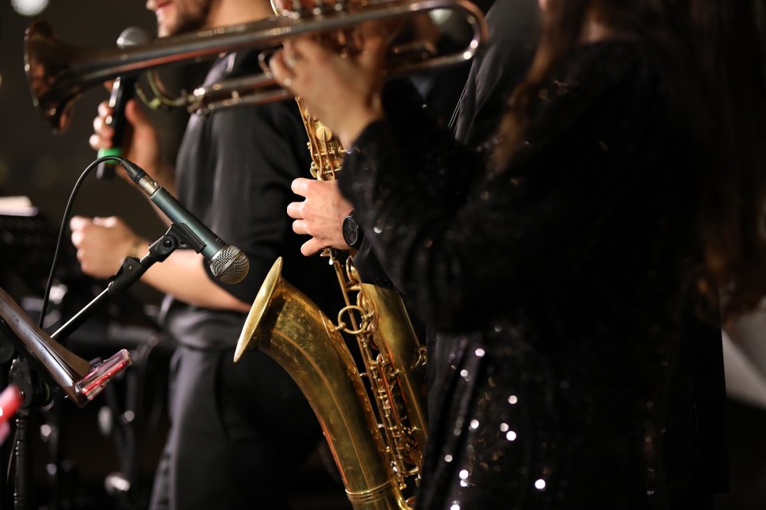 a,group,of,musicians,playing,with,a,focus,on,the