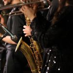 a,group,of,musicians,playing,with,a,focus,on,the